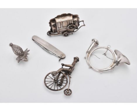 
	
		A collection of silver and silver coloured items, to include: a Dutch silver miniature model of a street organ, 7cm (2 3