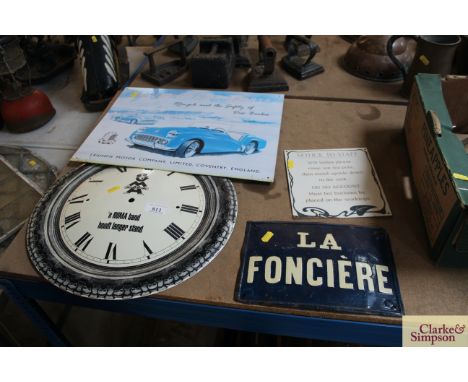 Three various enamel signs and an enamel circular clock face