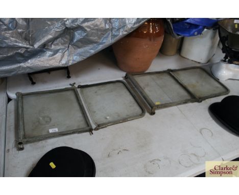 A section of vintage car window / windscreen panels 