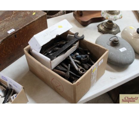 A box containing various small tools including spanners, hammers, nips etc.