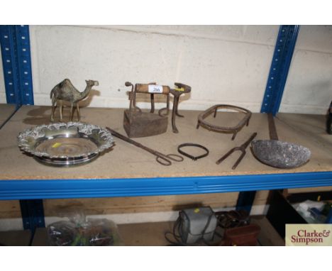 A Victorian plated coaster with turned wooden base; a small travelling iron; an iron ladle and various other items 