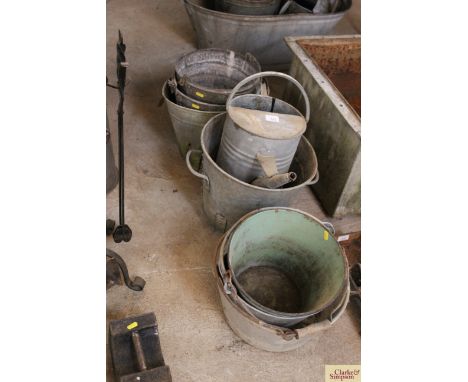 Various galvanised buckets, a two gallon galvanised watering can, enamel slops pail etc. 