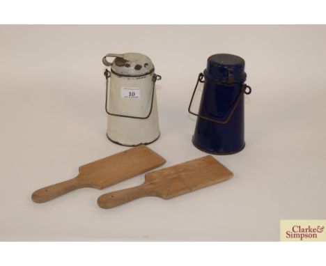 Two small enamel cream jugs and a pair of wooden butter pats