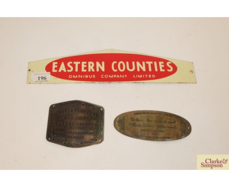 An "Eastern Counties Omnibus Co.Ltd." enamel sign and two replica brass signs 