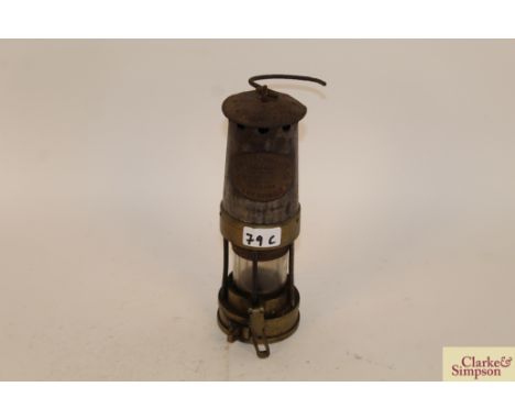 A brass and metal miners lamp by Thomas and Williams of Aberdare Cambrian type No.5