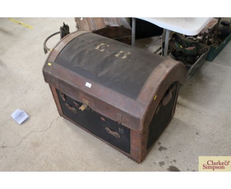 A dome topped leather bound fitted cabin trunk