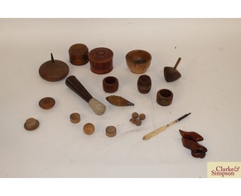 A box of miscellaneous treen items including spinning tops, salt bowl, snuff bottle, two oak warship souvenirs and miniature 
