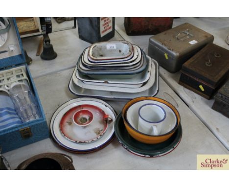 A quantity of enamel ware including cooking dishes, candle stand etc.