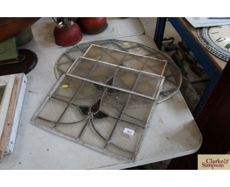 An oval leaded light window panel and three others 