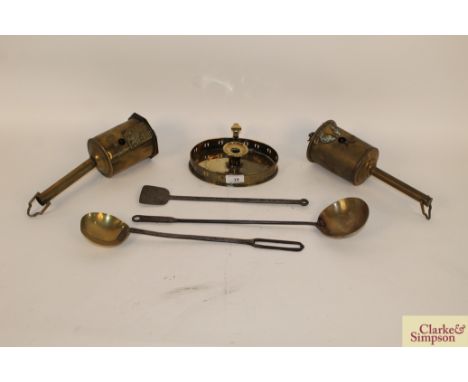 Two early 19th Century brass down hearth bottle jacks / rotating spits; an early 19th Century oval brass chamber stick; two G