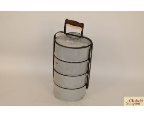A four tier white enamel farmer's lunch carrier 