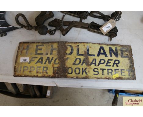 An enamel sign for H.E.Holland Fancy Draper Upper Brook Street