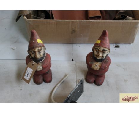 A pair of vintage cast iron garden gnomes 
