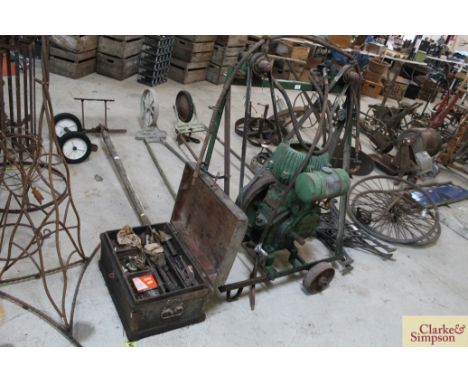 A vintage Wolsley stationery engine operating a vintage framed twin sheep shearer and a box of accessories