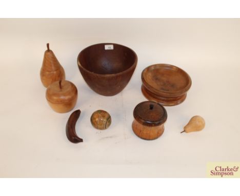 Three turned wooden bowls; an oak tea caddy and various turned wooden boxes in the form of fruit