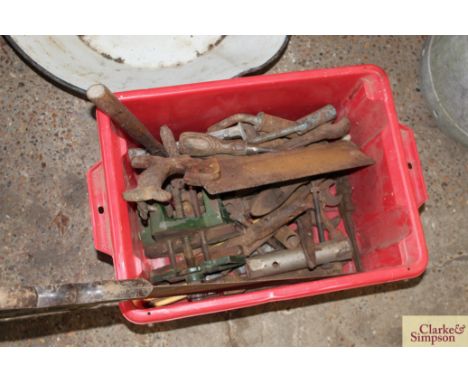 A box of hand tools and a saw 