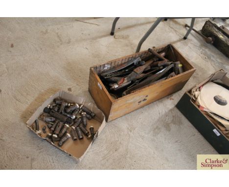 A box of metal raw plugs and a box of various hand tools 