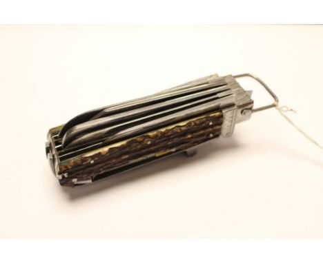 A multi purpose vintage pen knife with 16 blades / tools. Horn grips. Overall length 15cm. No makers marks. Good quality. No 