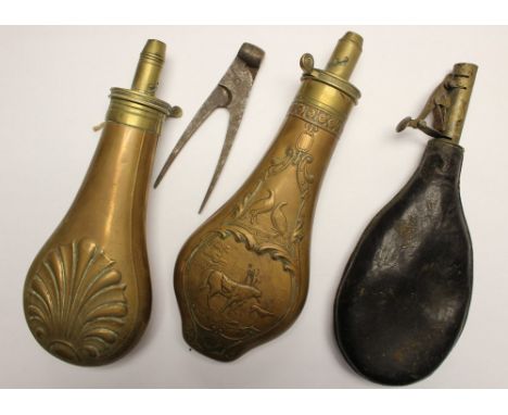 Two copper and brass powder flasks, one with horse and soldier design, together with a leather shot flask and a small bullet 