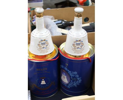 Two boxed Bells whisky Commemorative decanters; together with two further Bells Scotch whisky decanters, commemorating the bi