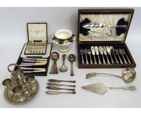 A silver plated egg cup & spoon set for four, a cased fish knife & fork set with servers, other plated wares & a Cauldon foot