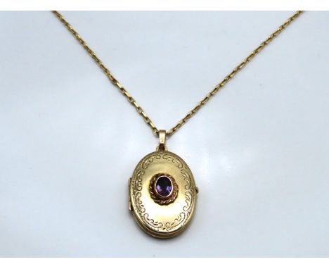 A 9ct gold 490mm long chain with 9ct locket set with amethyst, 35mm drop, 6.6g