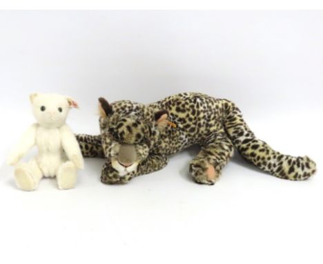 A Steiff plush leopard twinned with Steiff white cat, largest 590mm long 