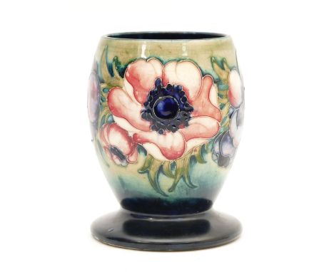 A Moorcroft vase, in the pattern, 'Anemone', with pink and purple florals on green/blue ground, manufactured between 1928 and