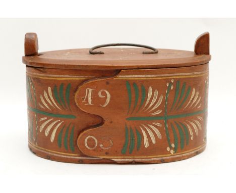 A Scandinavian Folk Art bentwood oval box, handpainted with floral details, date of 1903 paint onto the front and a name pain