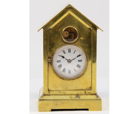 A late 19th century brass 'Sentry Box' desk timepiece, with visible escapement above the white enamel dial, movement numbered