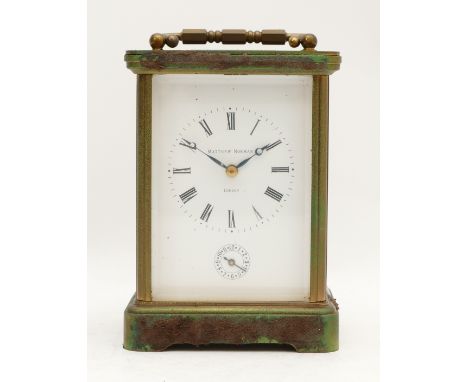 Matthew Norman, London, an early 20th century brass alarm and striking carriage clock, the white enamel dial with Roman numer