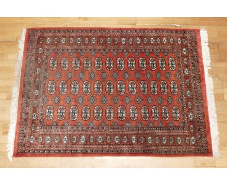A hand-knotted Teke Turkmen Bokhara Deluxe rug, with a fringe trim, the Teke design is inspired by elephant footprints, 178cm