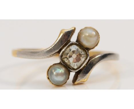 An Edwardian 18ct gold and plat old cut diamond and pearl three stone ring, approximately 0.40cts, colour estimate G/H, clari