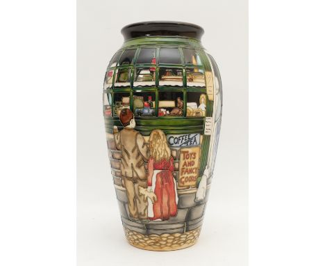 A Moorcroft vase, in the pattern, 'The Little Shop', limited edition, 42/150. Designed by Paul Hilditch, dated 2007, H-30cm. 