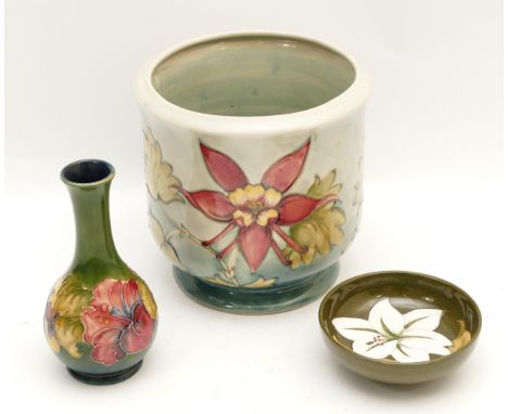 Three Moorcroft pieces, with signatures to the base indicating an manufacturing period of 1950-86, to include a planter, in t