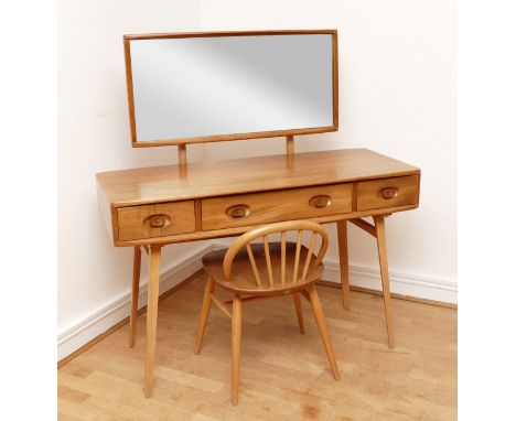 A 1960s Ercol 'Windsor' light elm dressing table and chair, the rounded rectangular top mounted by rectangular mirror, over t