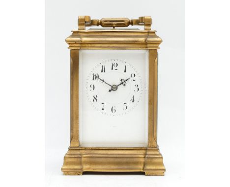 A late 19th century French brass carriage striking and repeating clock, the white enamel  dial signed indistinctly, the movem