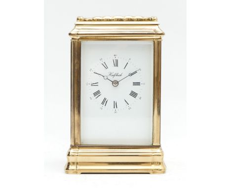 Halfhide, a brass striking carriage clock, signed white enamel dial with Roman numerals, the Anglaise 11 jewel movement strik