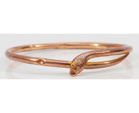 A Victorian 9ct rose gold entwined snake slave bangle, stamped 9ct, PPLd, 9ct, with engraved head and tail, 70mm internal dia
