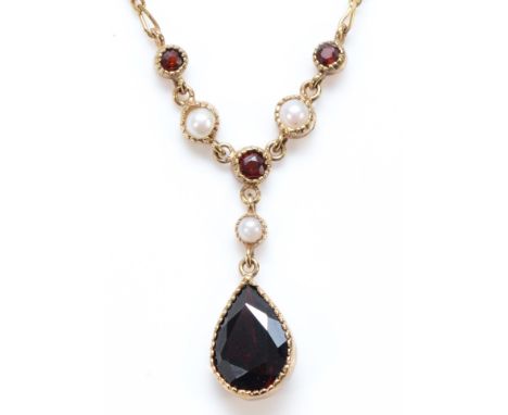 A 9ct gold garnet and seed pearl drop necklace, main garnet measures 10mm x 7mm, 2.9gLength of the full chain, from the drop 