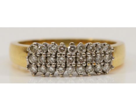 An 18ct gold diamond ring, three rows of brilliant cut diamonds, twenty seven diamonds in total, N, 4.6g