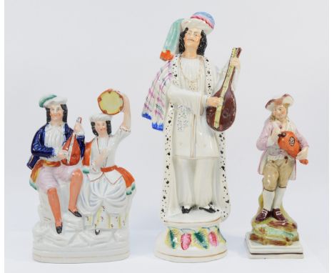 A Staffordshire Pottery flatback figure, depicting two musicians holding instruments, designed c. 1880, H-22cm, together with