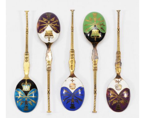 A silver gilt and enamel set of five commemorative Coronation tea spoons, only two hallmarked, Birmingham 1978, the bowls wit