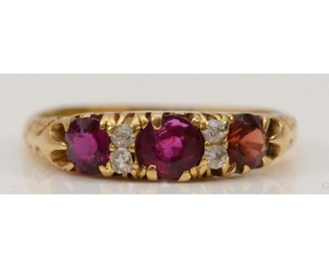 An 18ct gold old cut diamond, ruby and garnet ring, N, 2.9g