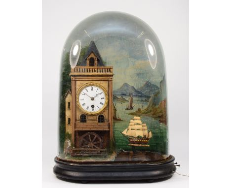 A late 19th century French or Swiss musical, automaton and time piece, the white enamel dial housed in a watermill with rotat