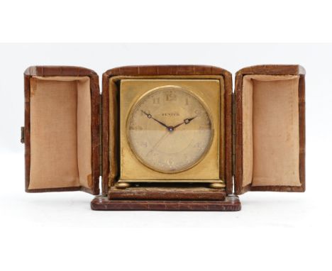 Zenith, an Art Deco gold plated alarm travel clock, gilt dial, raised on ball feet, 5 x 5 x 3cm, original crocodile case.Cloc