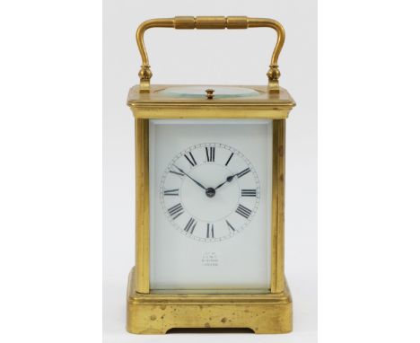Dent, an early 20th century brass repeating and striking carriage clock, white enamel dial the movement striking the half and