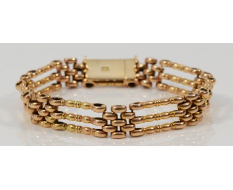 An Edwardian 15ct rose gold gate bracelet, 15C stamp, 18cm, 17.3gm