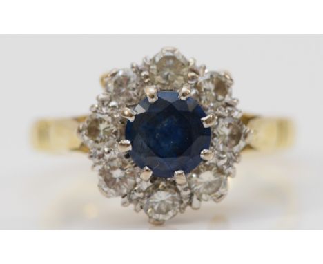 A vintage 18ct gold sapphire and brilliant cut diamond cluster ring, diamond weight approximately 0.80cts, O, 5.3gm