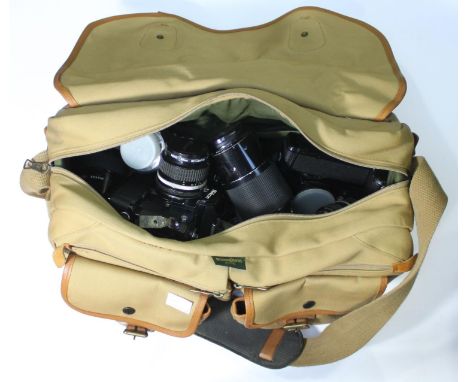 Two Nikon MD-12 cameras, Nos. 1650864 &amp; 1017527, together with four lenses and a Teleconverter etc. in fitted canvas came